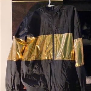 A black a gold champs sporting goods windbreaker
